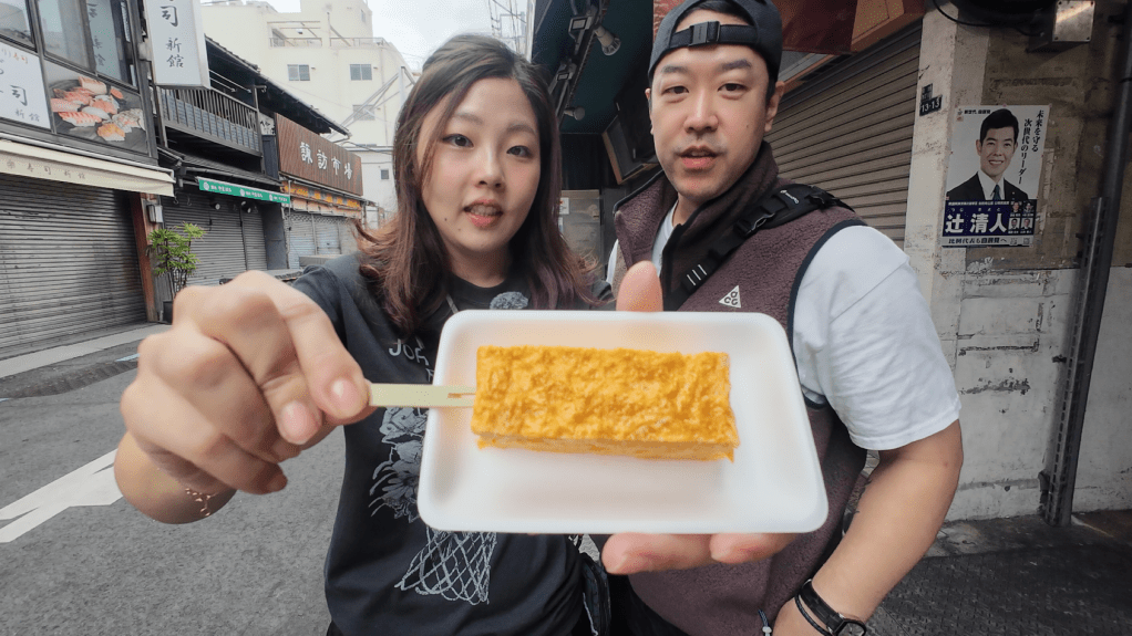 Tamagoyaki sweet Japanese rolled omelette on stick Tsukiji Outer Market Tokyo street food review