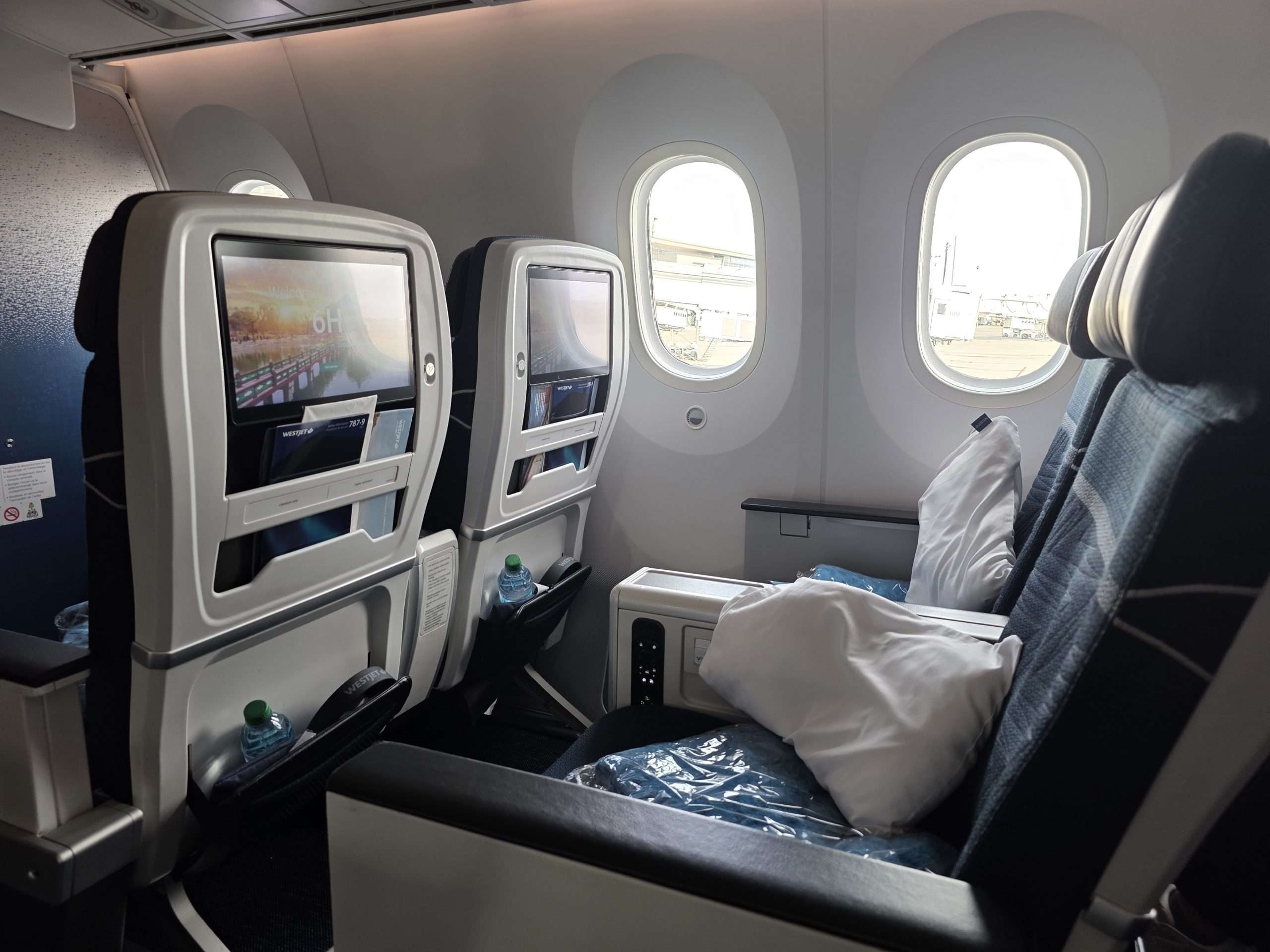 WestJet Premium Economy seat legroom and footrest on the Boeing 787-9