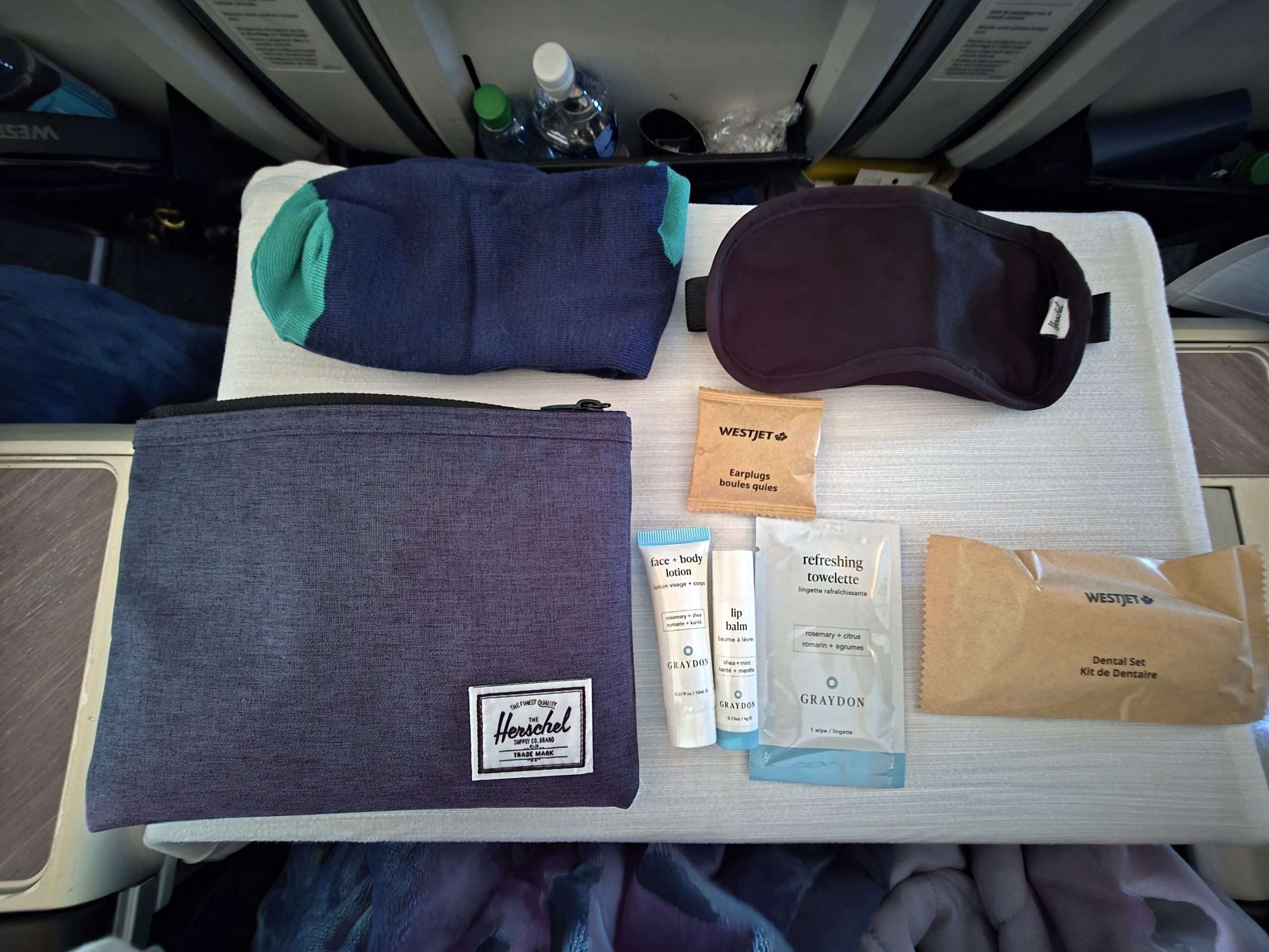 WestJet Premium Economy Herschel amenity kit contents eye mask socks dental kit