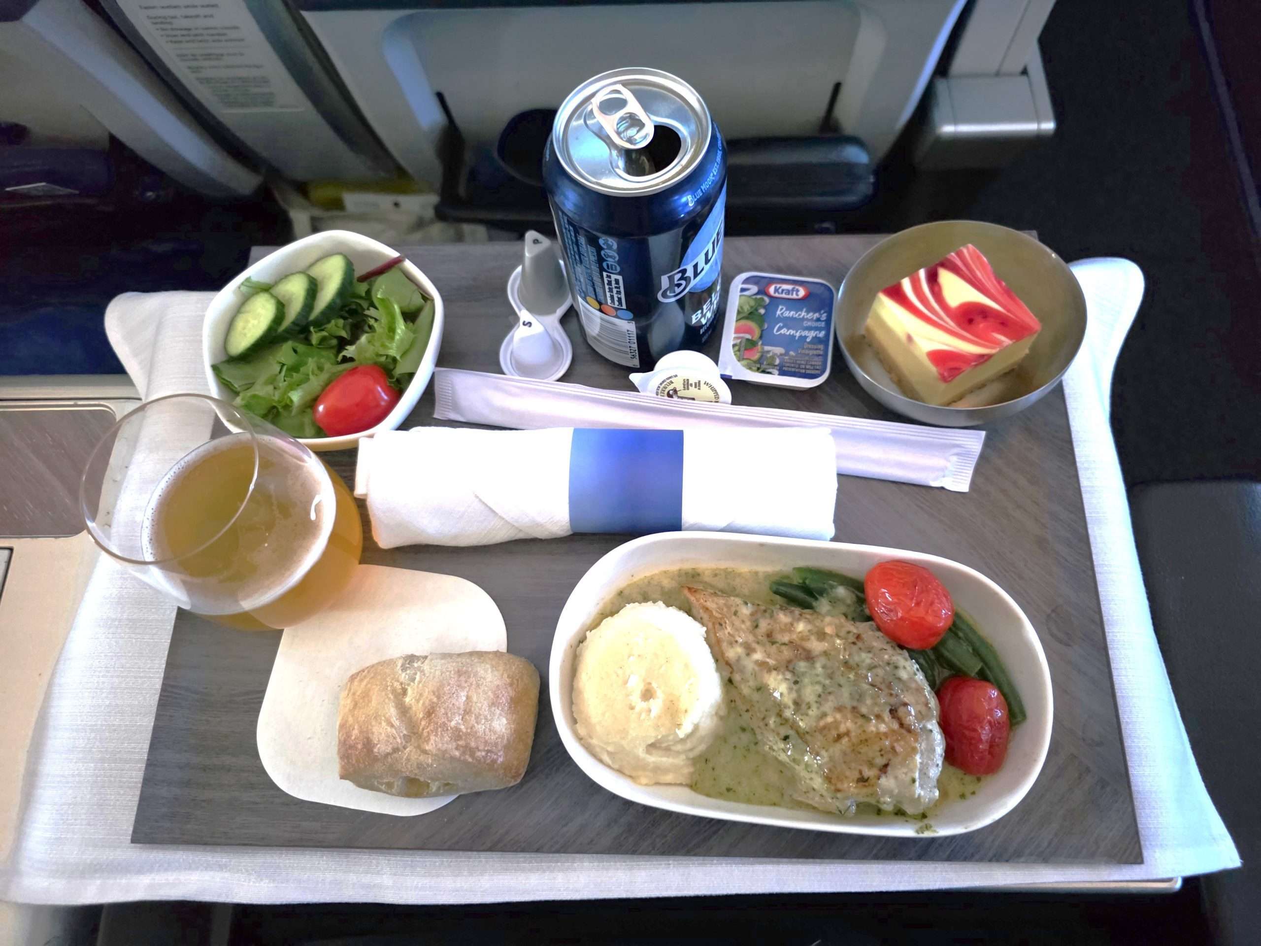 WestJet Premium Economy full dinner tray tablecloth beer salad bread Calgary Seoul