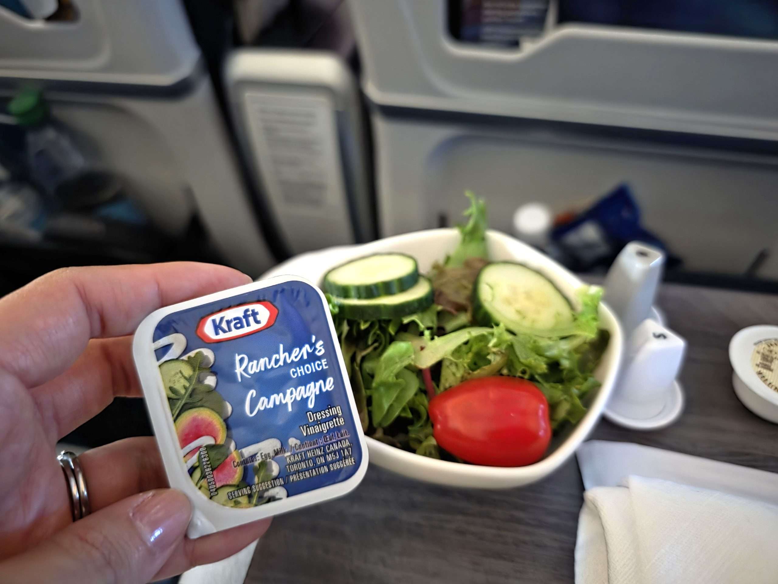 WestJet Premium Economy dinner salad Kraft Rancher dressing mixed greens tomato cucumber