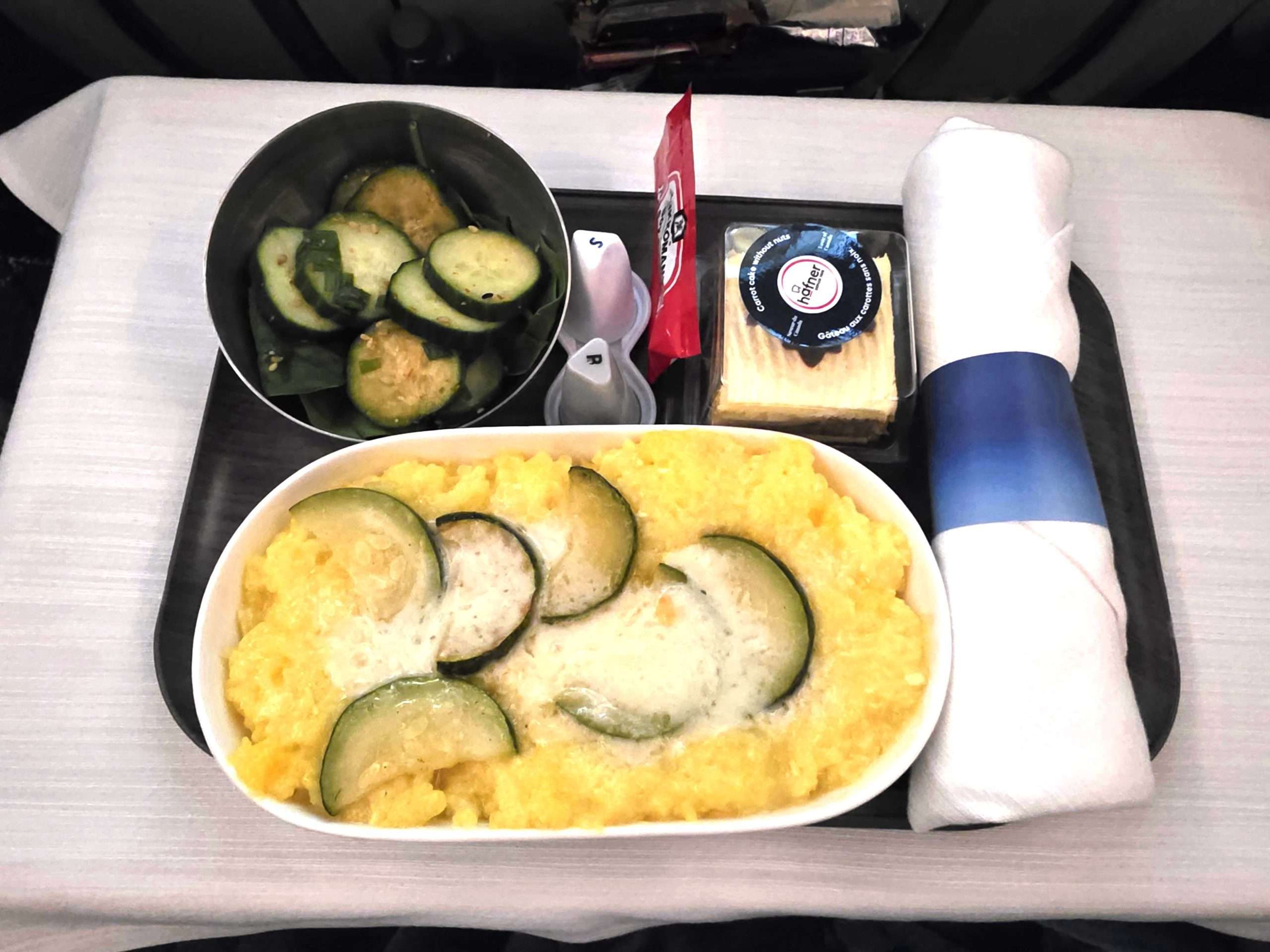 WestJet Premium Economy breakfast saffron risotto cucumber salad inflight meal review