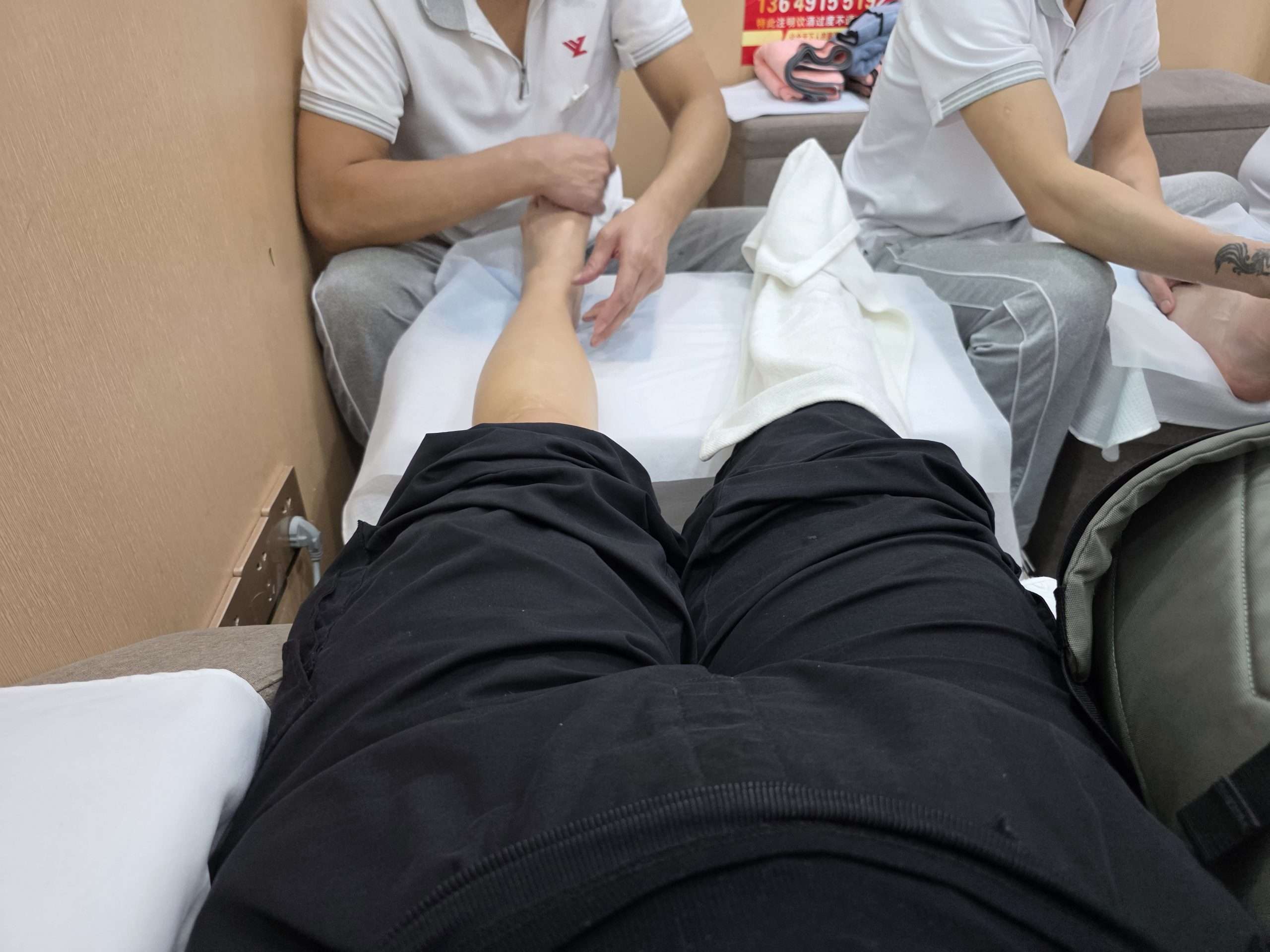 Zhengyuanyuan therapist foot massage white towel Shanghai China