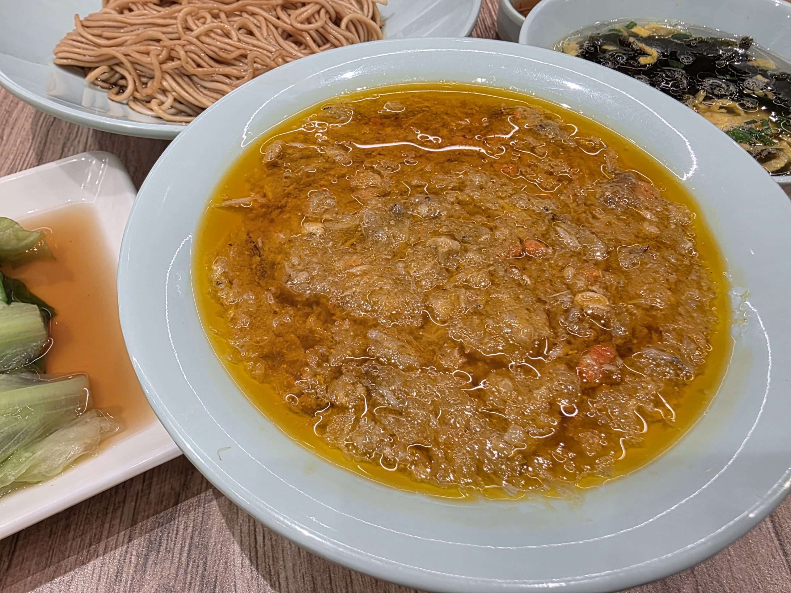 Jia Jia Tang Bao crab roe sauce close up glossy orange Shanghai