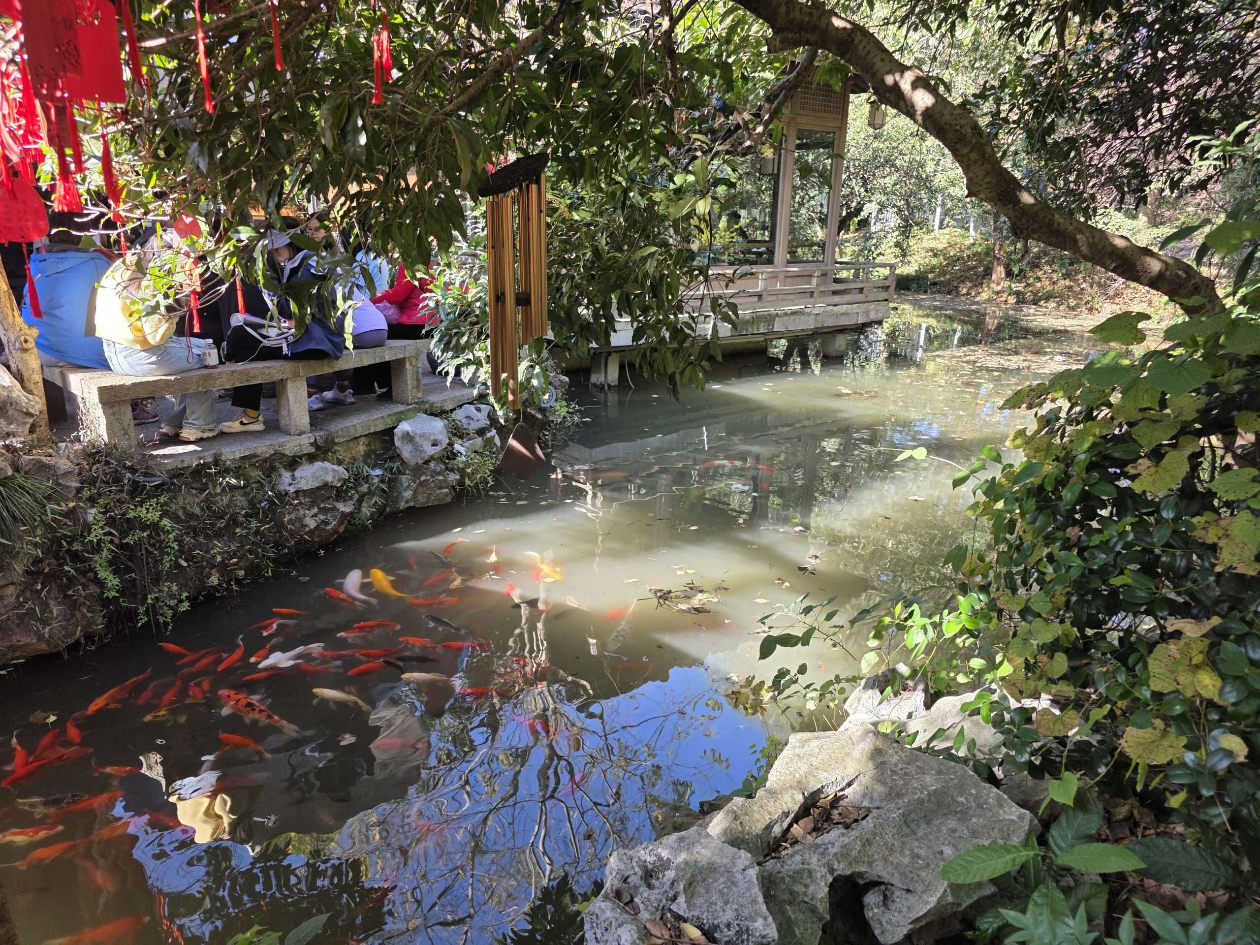 West Lake Hangzhou waterfront promenade trees reflection China travel guide
