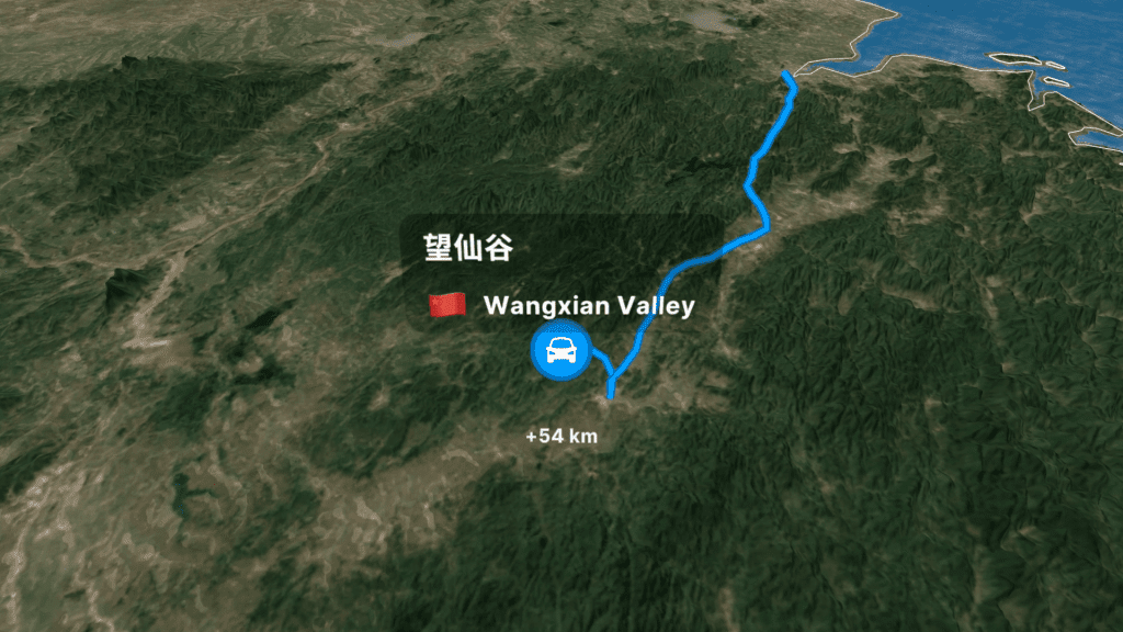 Wangxian Valley cliffside buildings amber glow night Jiangxi China
