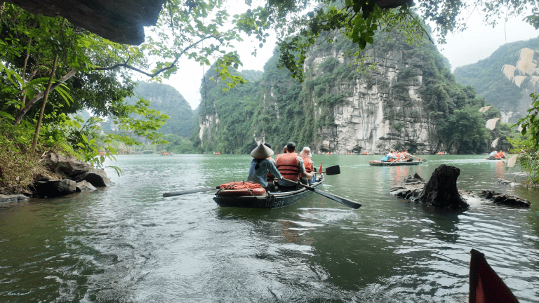 Tam Coc boat woman rowing bamboo Ninh Binh Vietnam