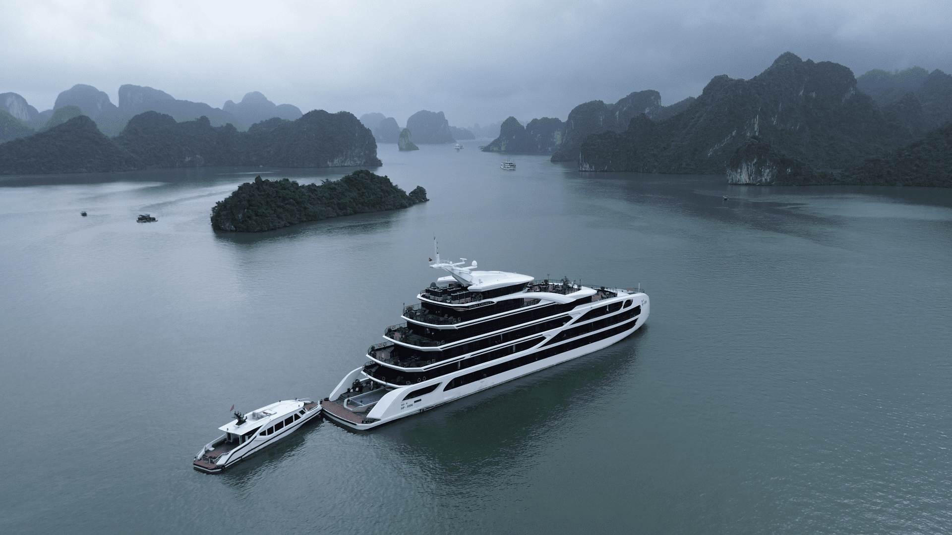 Our Diana cruise boat on Lan Ha Bay next to Ha Long Bay, Vietnam, seen from a drone