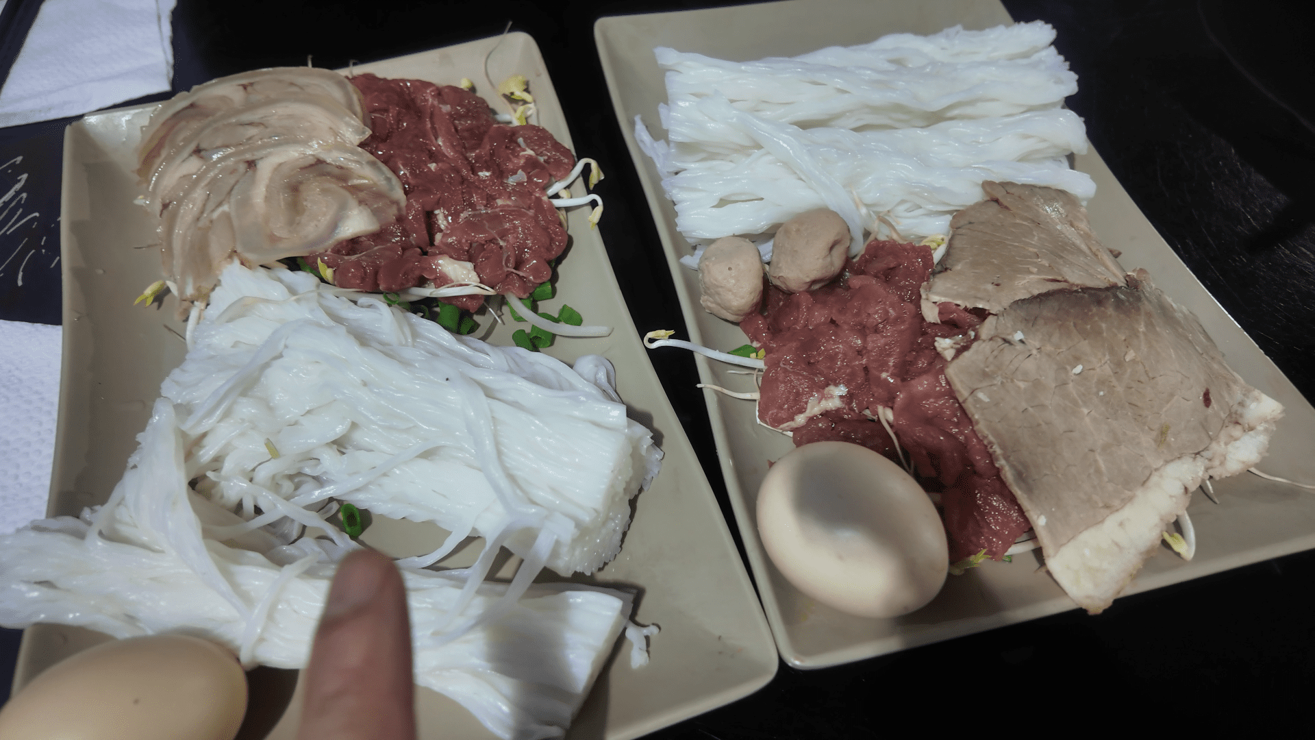 Pho Bat Da Da Nang raw egg cracked into boiling broth