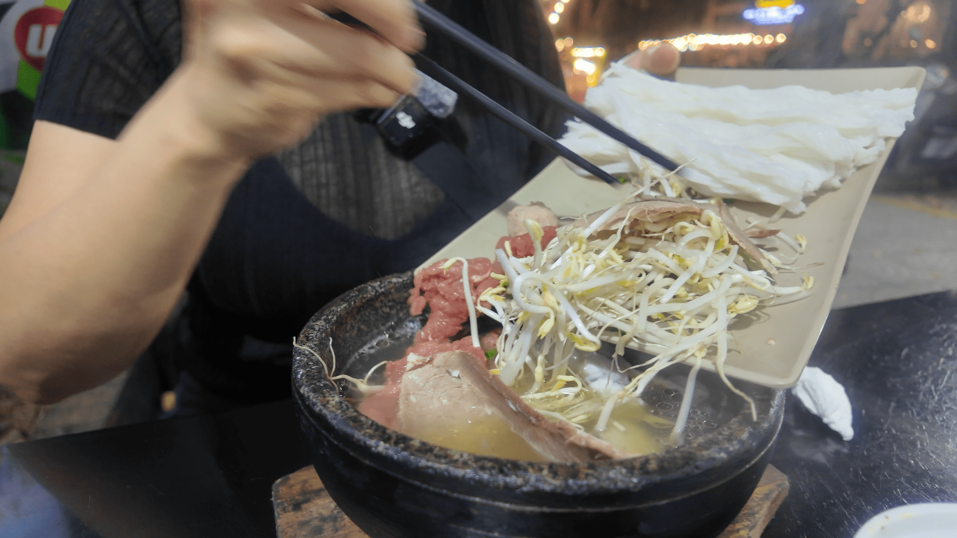 Stone bowl pho Da Nang broth steaming