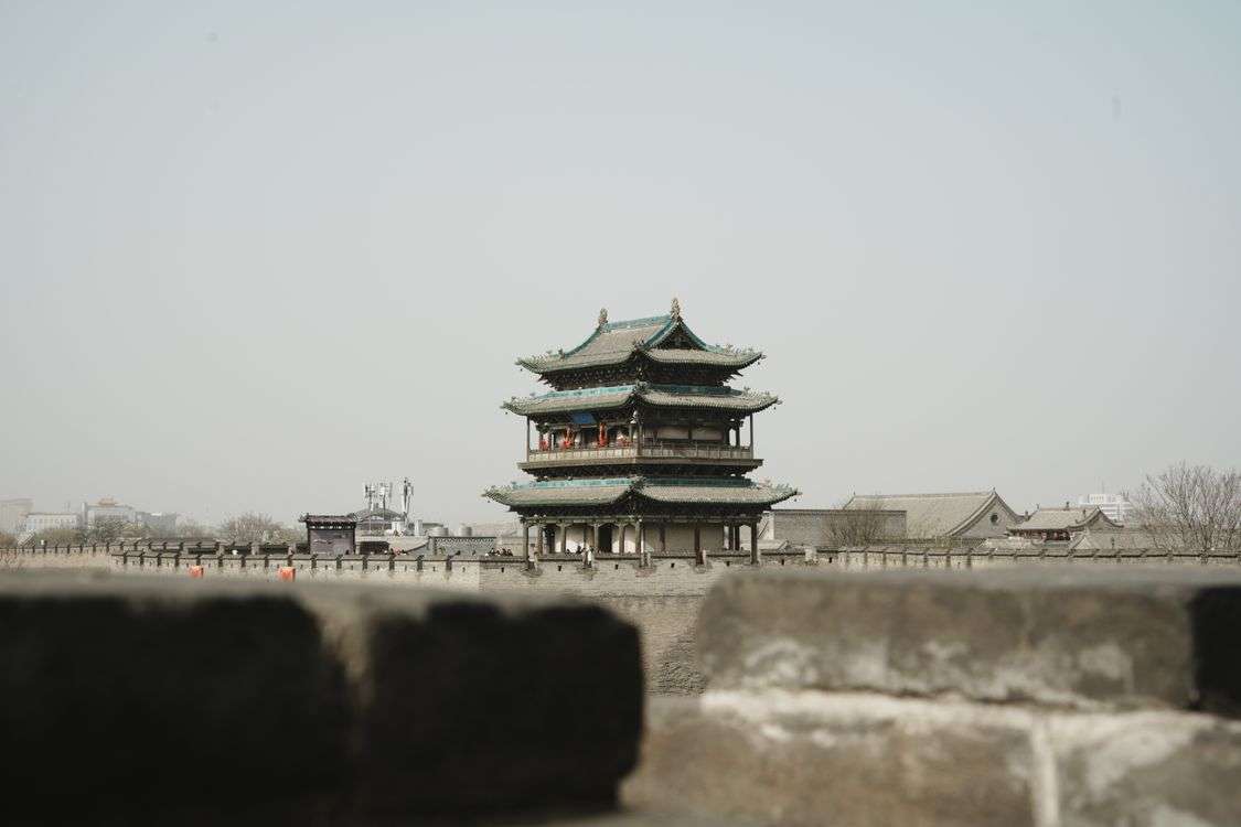 Traditional Chinese pavilion with dramatic sky