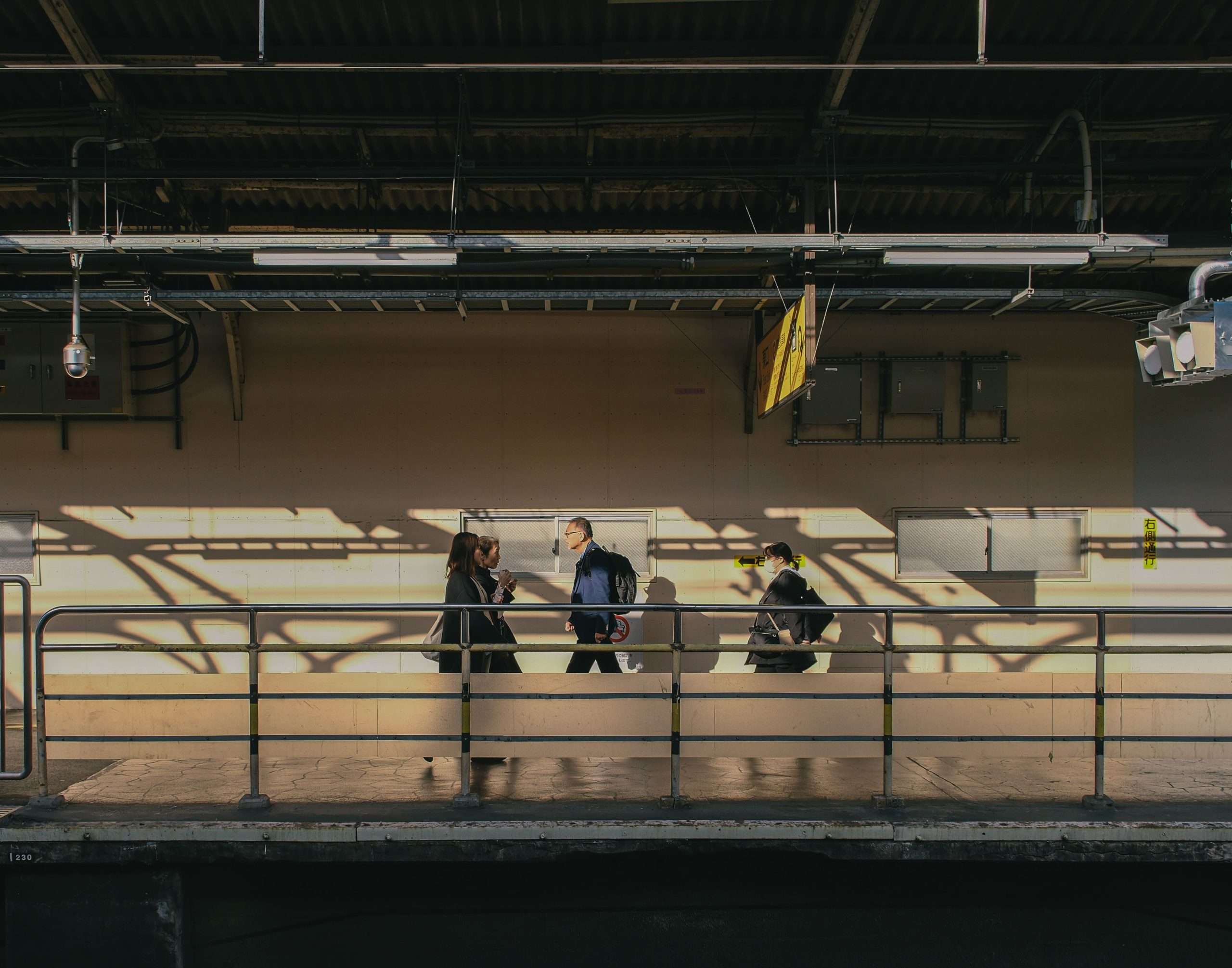 Commuters using IC cards at Japan subway platform
