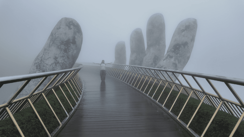 Empty Golden Bridge at Ba Na Hills in morning fog, Da Nang, Vietnam