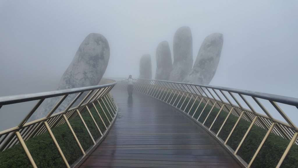 The Golden Bridge walkway at Ba Na Hills empty in early morning fog, Vietnam