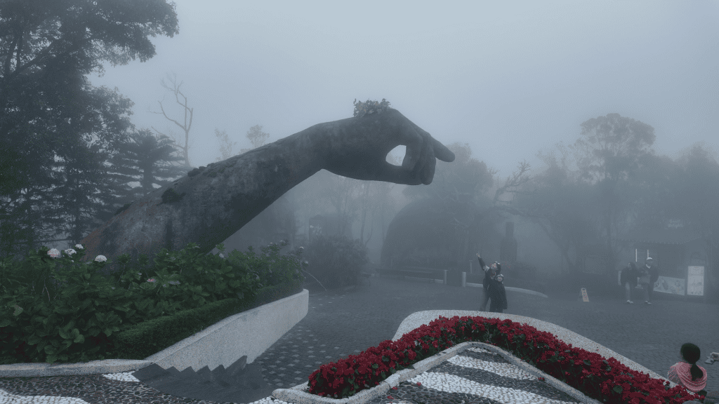 Giant stone hands sculpture in the Ba Na Hills gardens, Vietnam