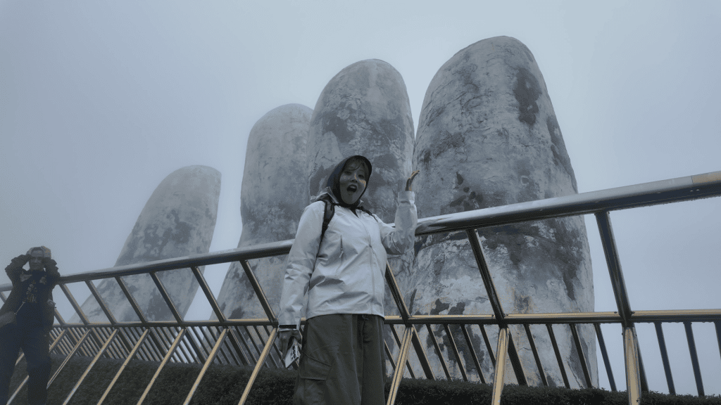 Visitor on the foggy Golden Bridge at Ba Na Hills, Da Nang, Vietnam